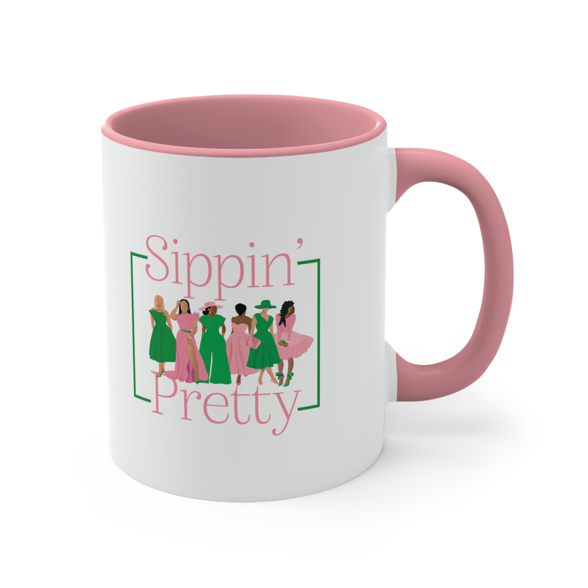 Side view of white ceramic mug with black women wearing pink and green outfits/Sippin' Pretty